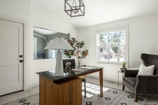a view of a dining room with furniture and window