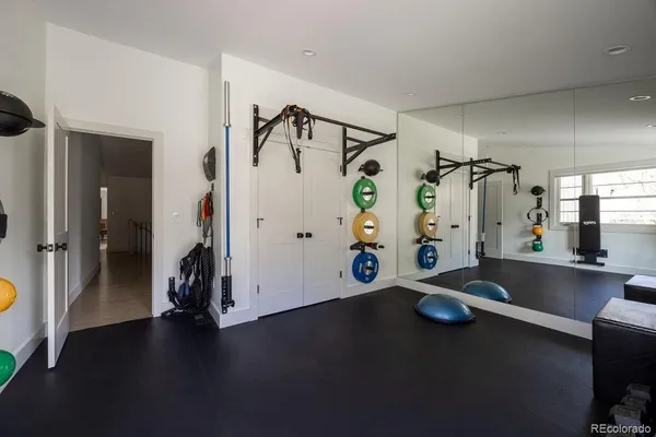 a bed room with gym equipment