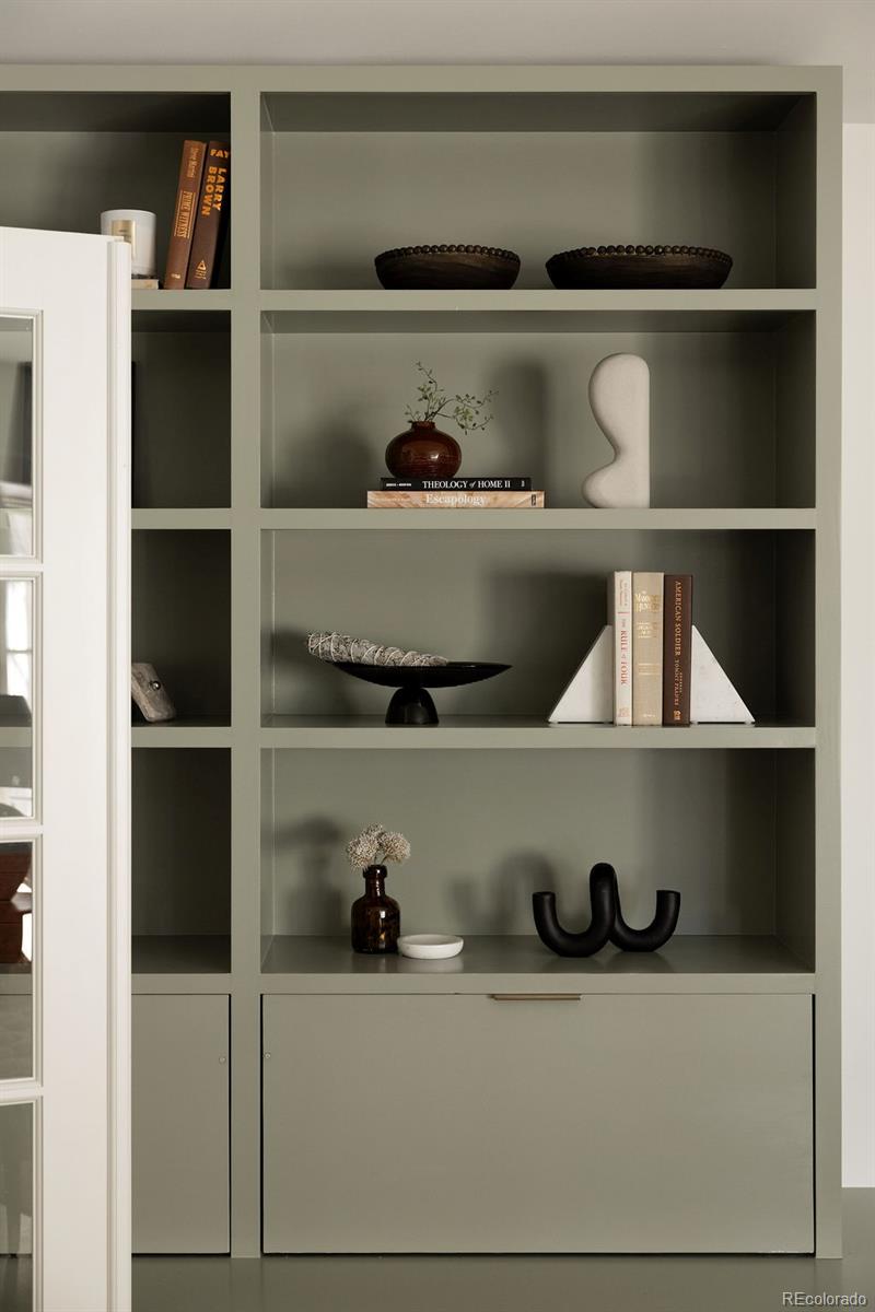 5151 West Wagon Trail Road Bow Mar, CO 80123 - Photo 5 of 50 a shelf with cup and plates