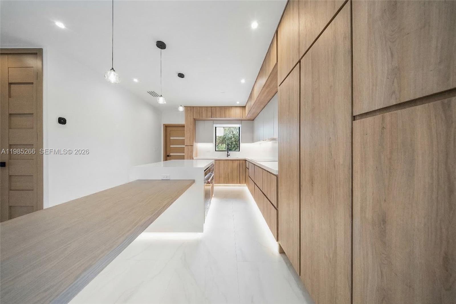 4241 Red Road Coral Gables, FL 33146 - Photo 12 of 51 a view of a hallway with wooden floor and staircase