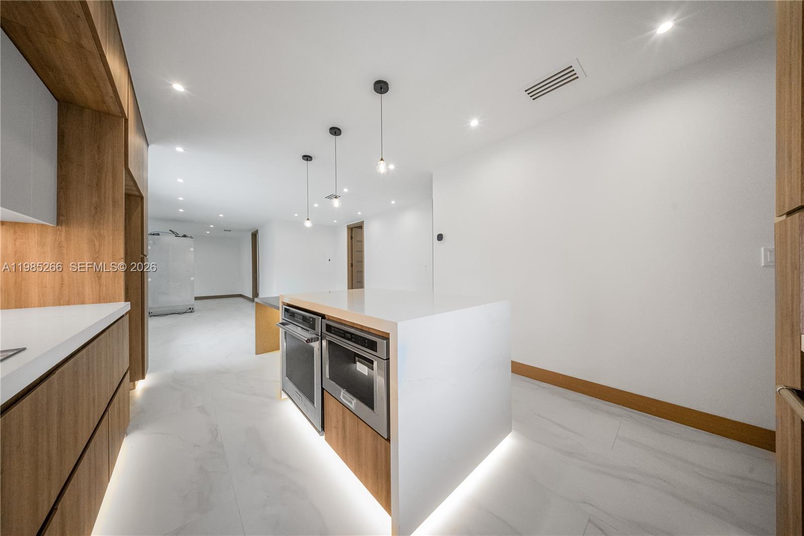 4241 Red Road Coral Gables, FL 33146 - Photo 13 of 51 a view of a kitchen with a sink and dishwasher a stove top oven