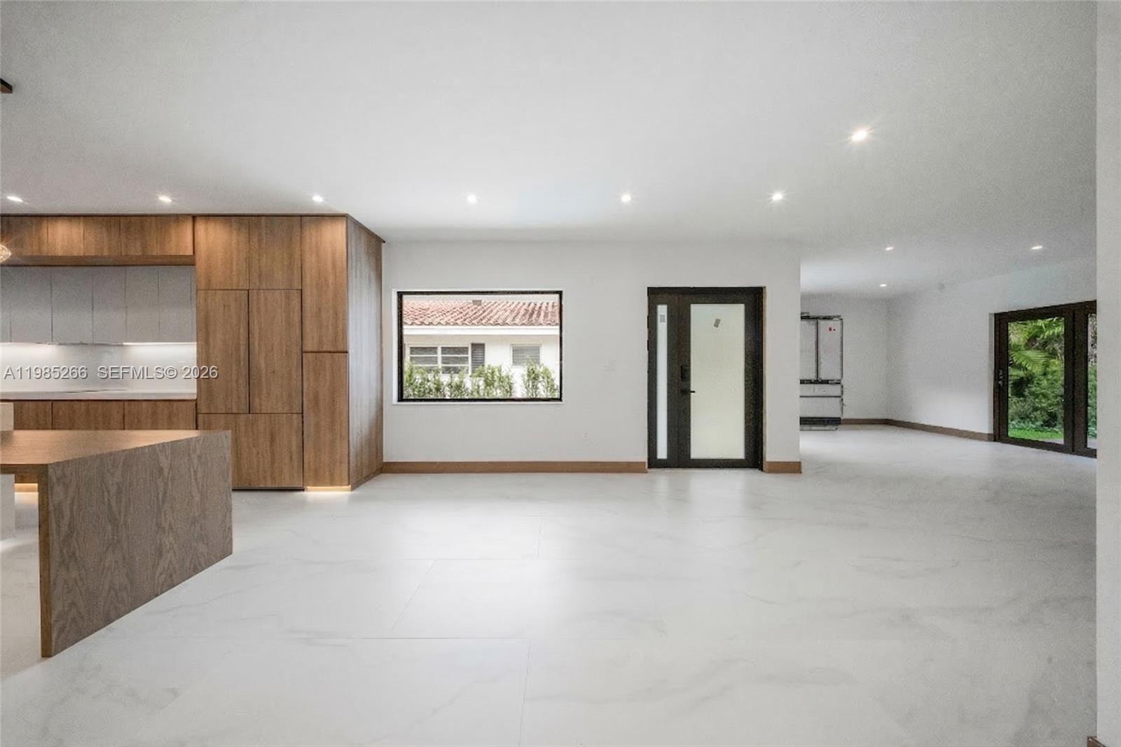 4241 Red Road Coral Gables, FL 33146 - Photo 15 of 51 an empty room with entrance and windows