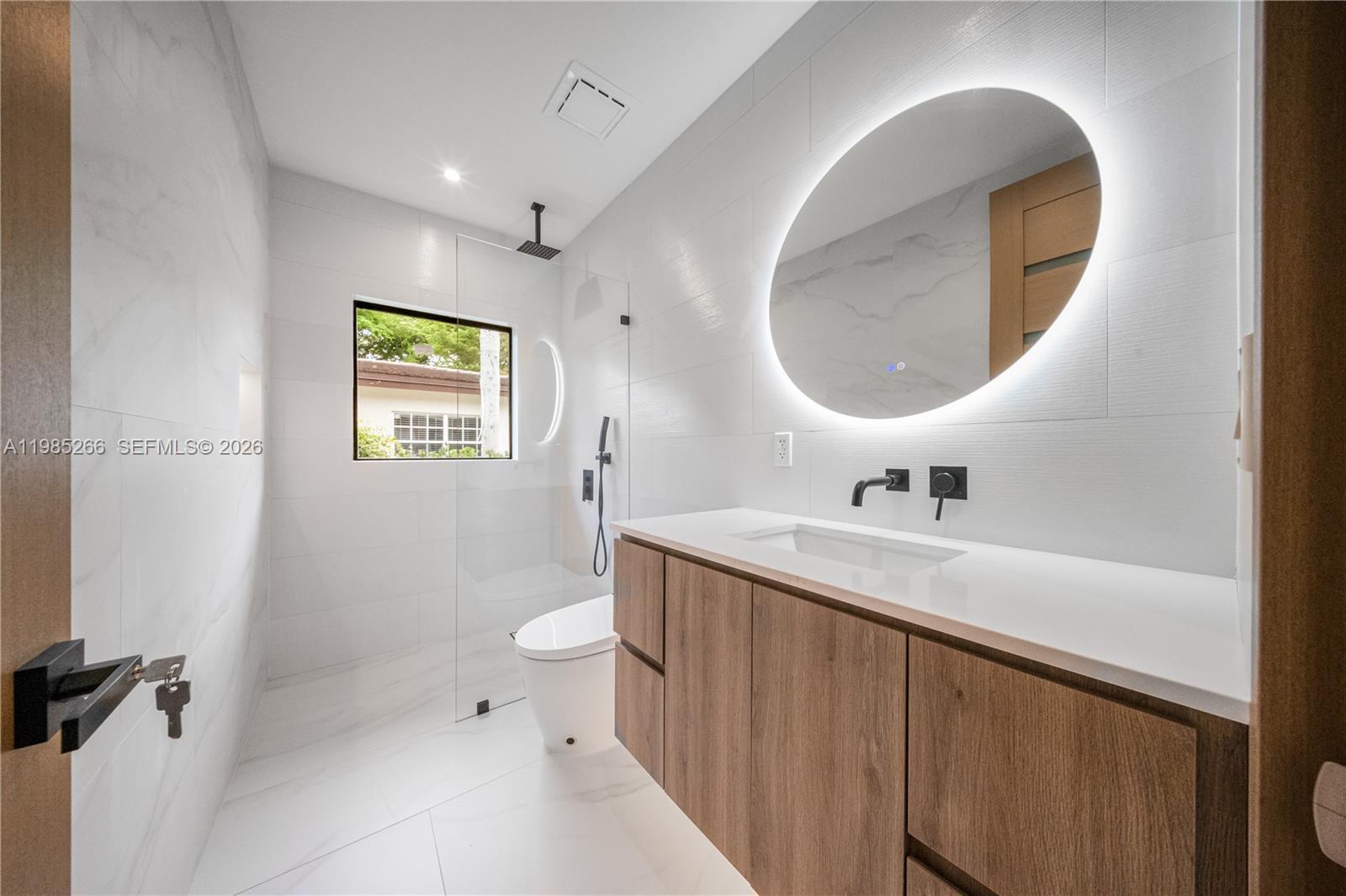 4241 Red Road Coral Gables, FL 33146 - Photo 17 of 51 a bathroom with a sink and a mirror
