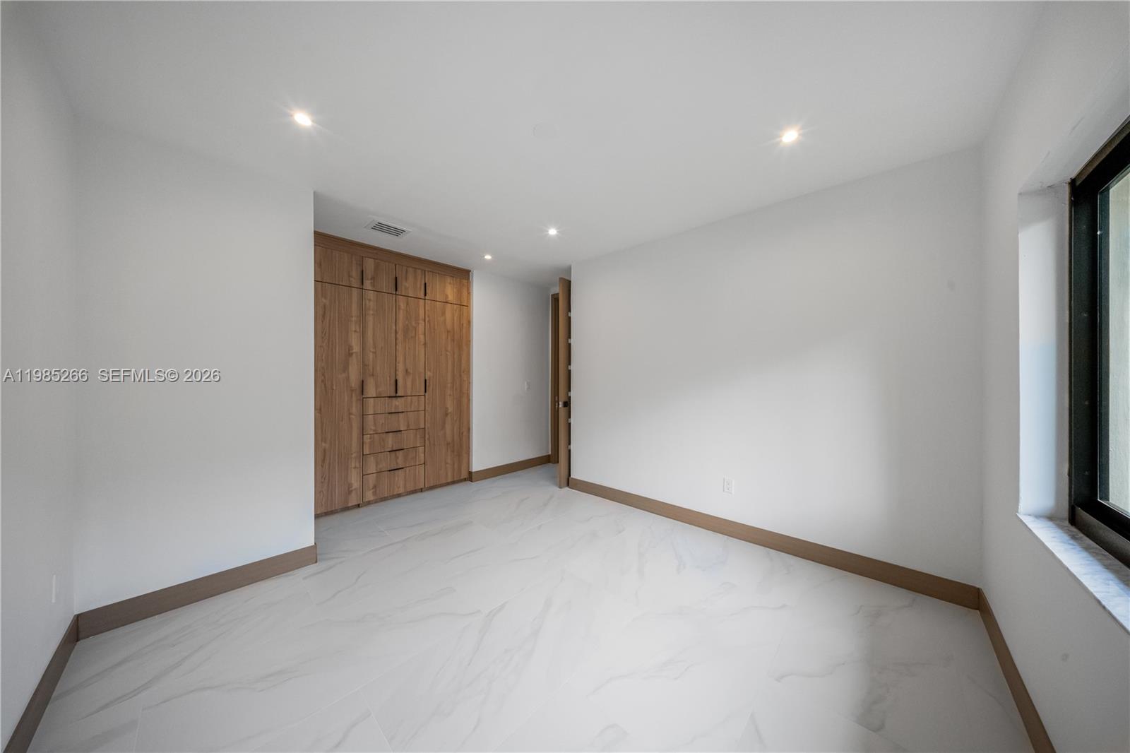 4241 Red Road Coral Gables, FL 33146 - Photo 20 of 51 a view of an empty room with a window