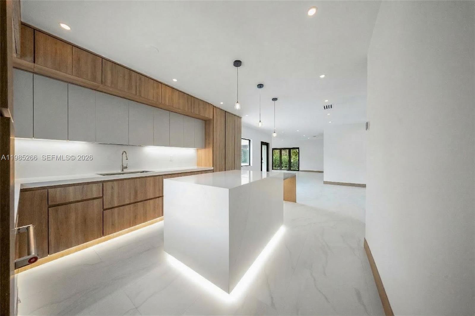 4241 Red Road Coral Gables, FL 33146 - Photo 21 of 51 a view of kitchen with cabinets and wooden floor