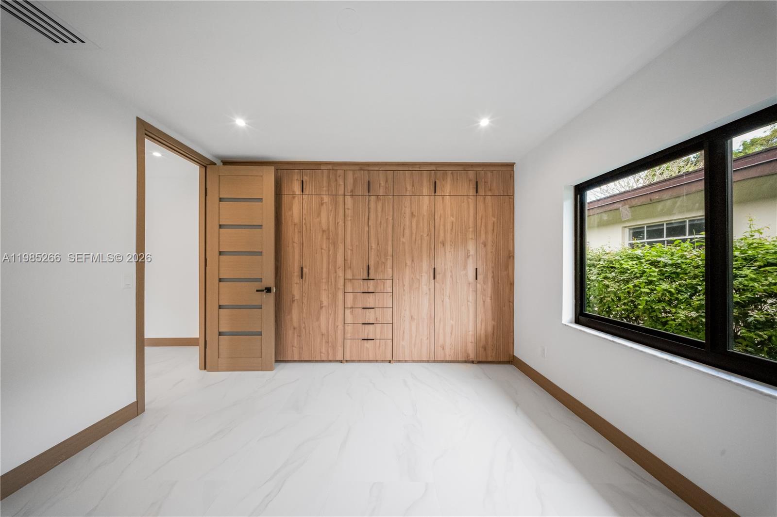 4241 Red Road Coral Gables, FL 33146 - Photo 23 of 51 a view of an empty room with a window