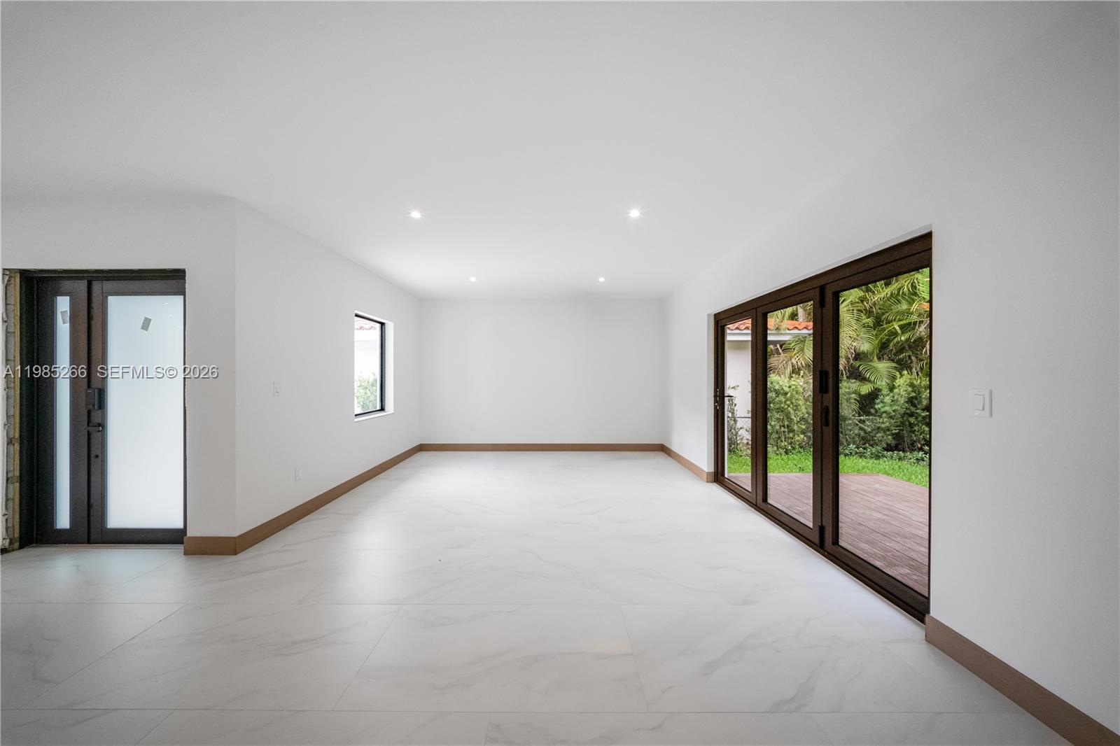 4241 Red Road Coral Gables, FL 33146 - Photo 25 of 51 a view of a big room with windows and view of an empty room