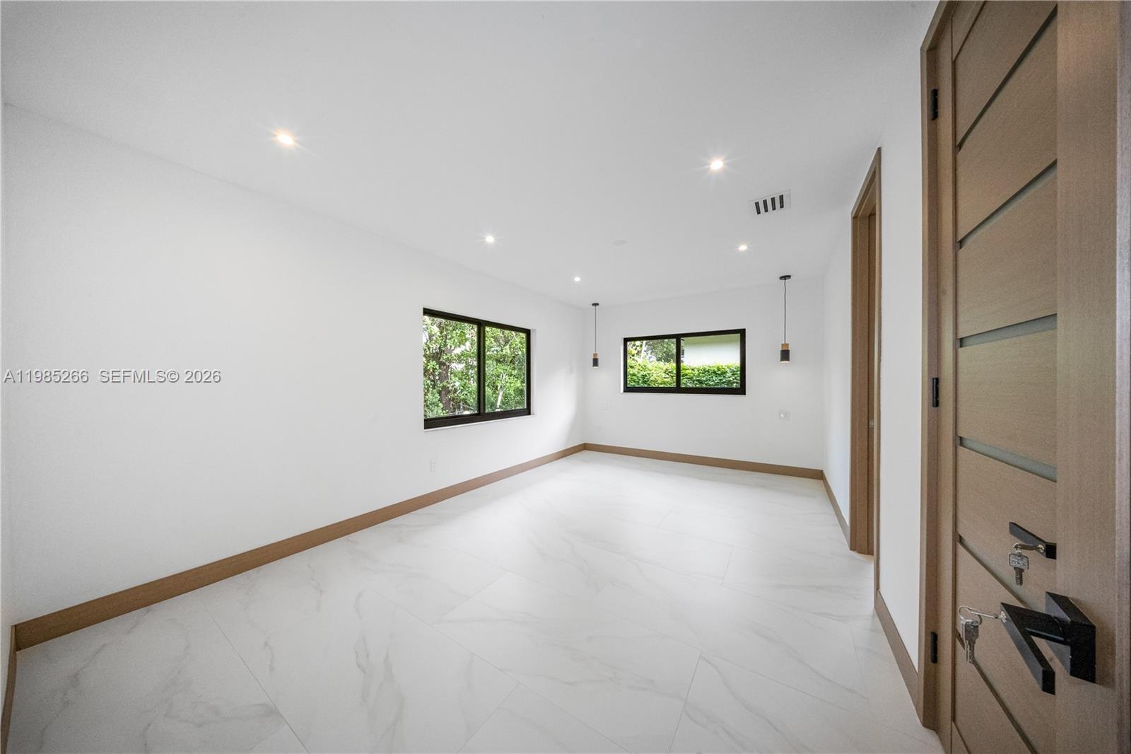 4241 Red Road Coral Gables, FL 33146 - Photo 27 of 51 a view of a room with a window and a kitchen