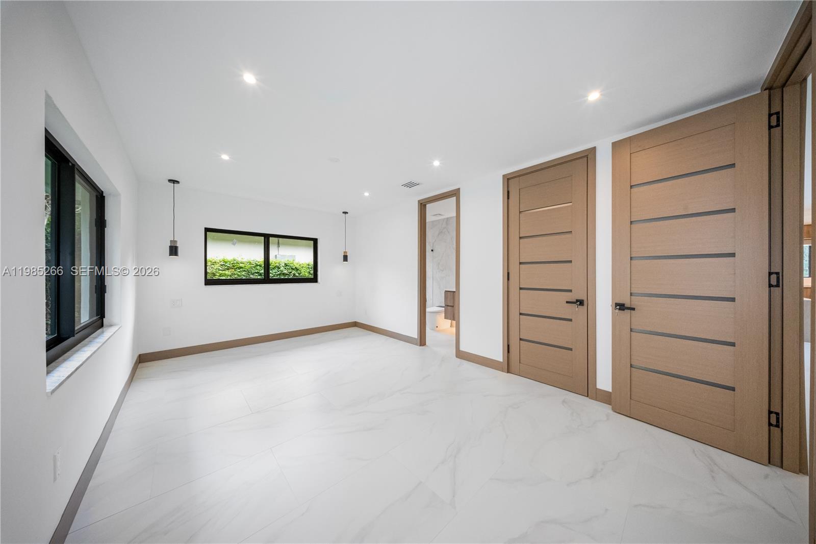4241 Red Road Coral Gables, FL 33146 - Photo 29 of 51 a view of empty room with windows and cabinet