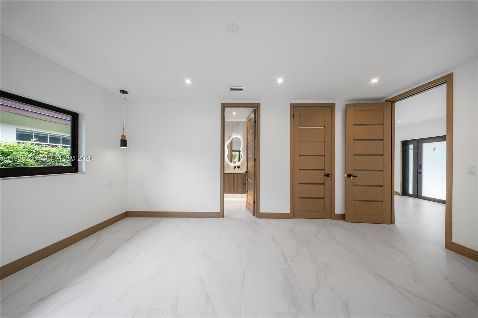 4241 Red Road Coral Gables, FL 33146 - Photo 30 of 51 a view of an empty room with a cabinet and a window