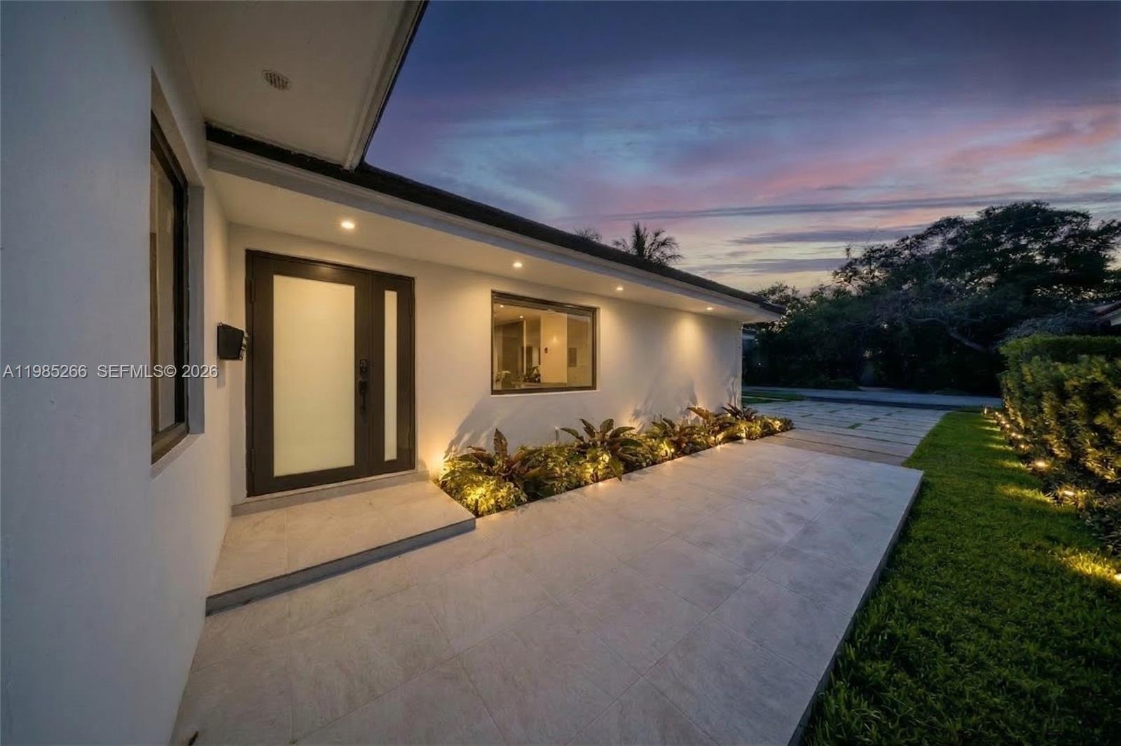 4241 Red Road Coral Gables, FL 33146 - Photo 3 of 51 a view of a house with backyard and garden