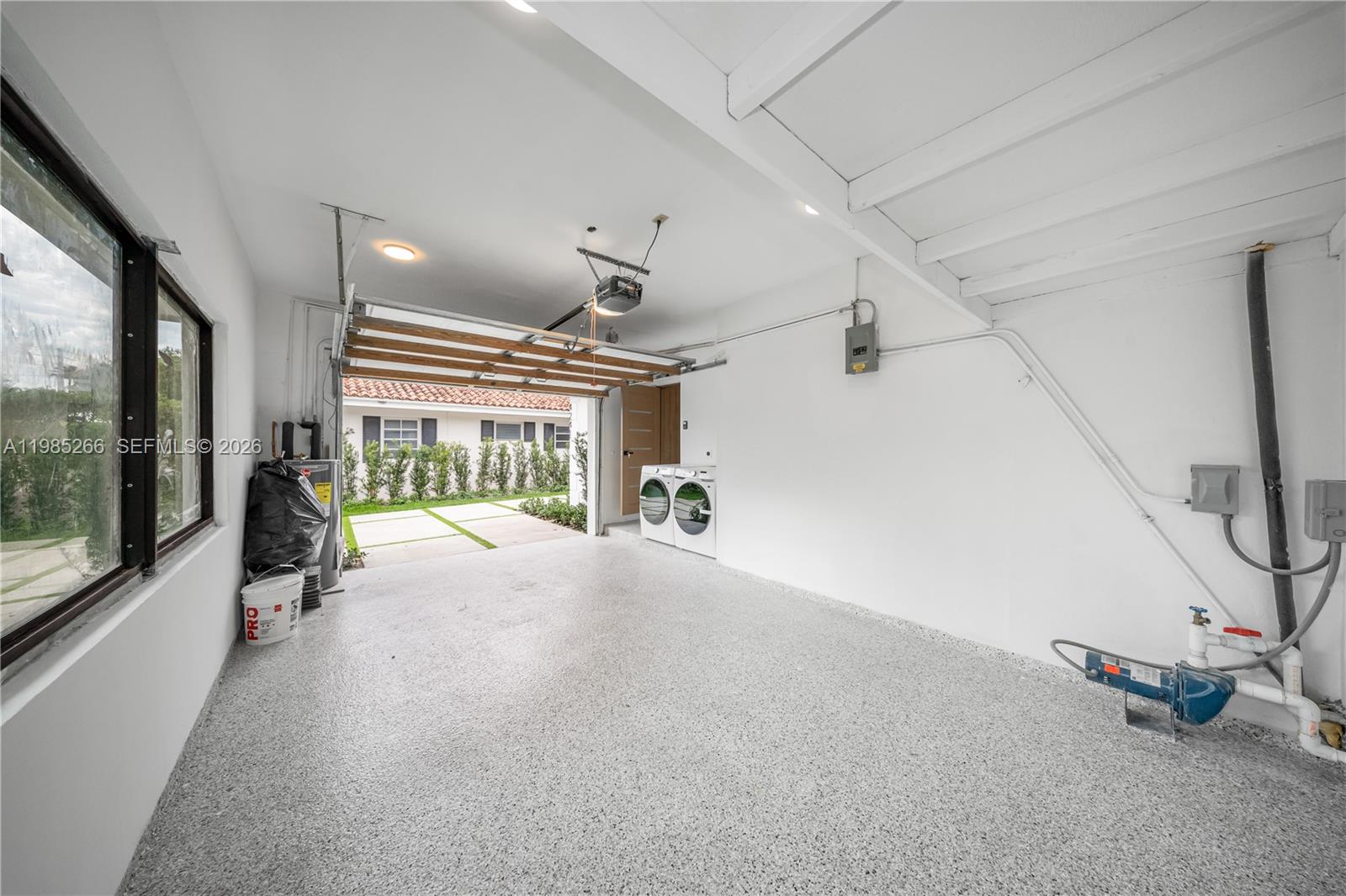 4241 Red Road Coral Gables, FL 33146 - Photo 36 of 51 a view of a room with windows and a flat screen tv