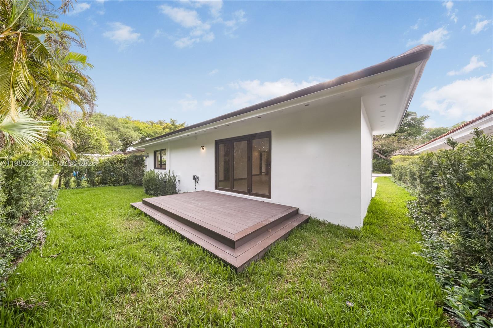 4241 Red Road Coral Gables, FL 33146 - Photo 40 of 51 a view of an house with backyard and a tree