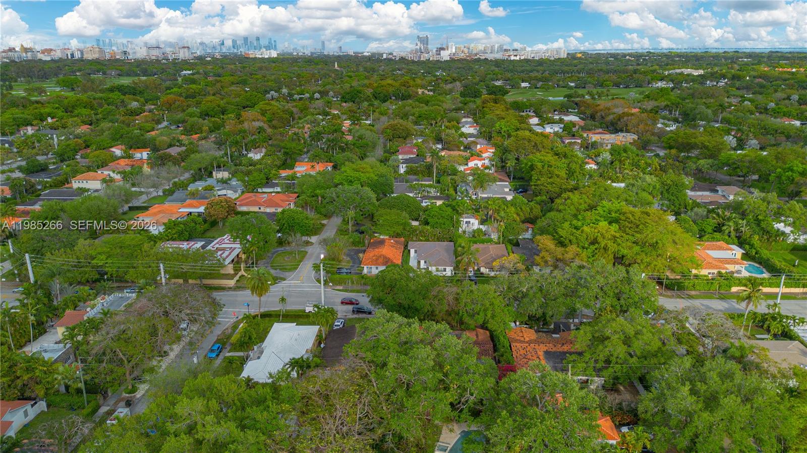4241 Red Road Coral Gables, FL 33146 - Photo 49 of 51 an aerial view of residential houses with outdoor space and trees