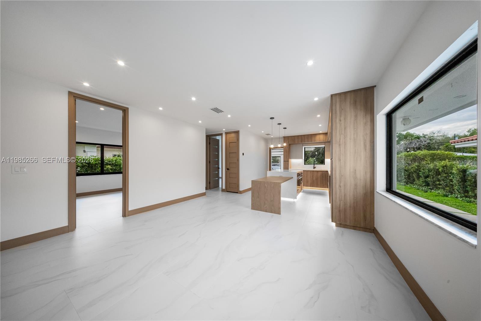 4241 Red Road Coral Gables, FL 33146 - Photo 9 of 51 a view of a kitchen with furniture and floor to ceiling window