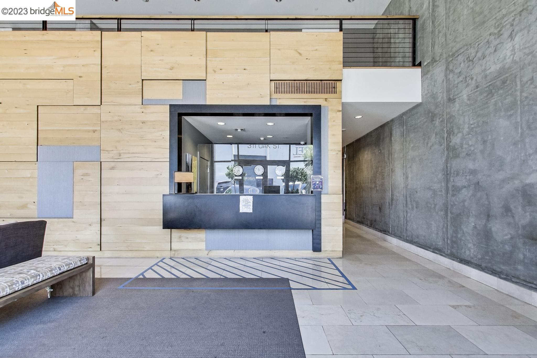 311 Oak Street, Unit 730 Oakland, CA 94607 - Photo 13 of 21 a living room with a couch and a table