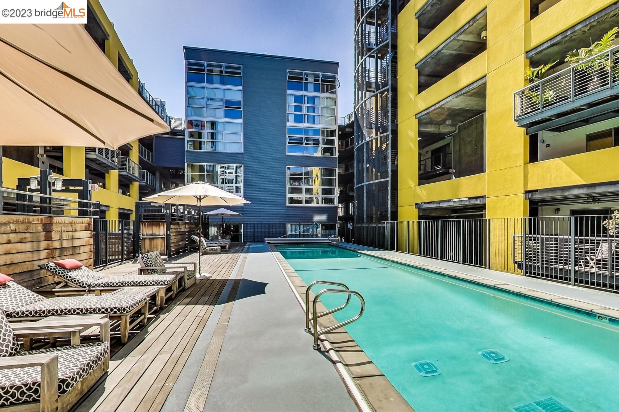 311 Oak Street, Unit 730 Oakland, CA 94607 - Photo 17 of 21 a view of a building with a backyard