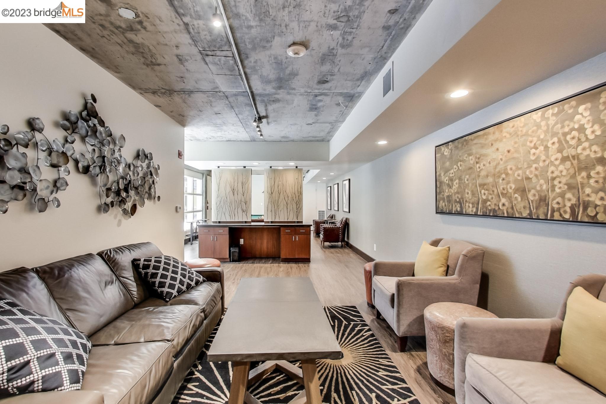 311 Oak Street, Unit 730 Oakland, CA 94607 - Photo 21 of 21 a living room with furniture and a chandelier
