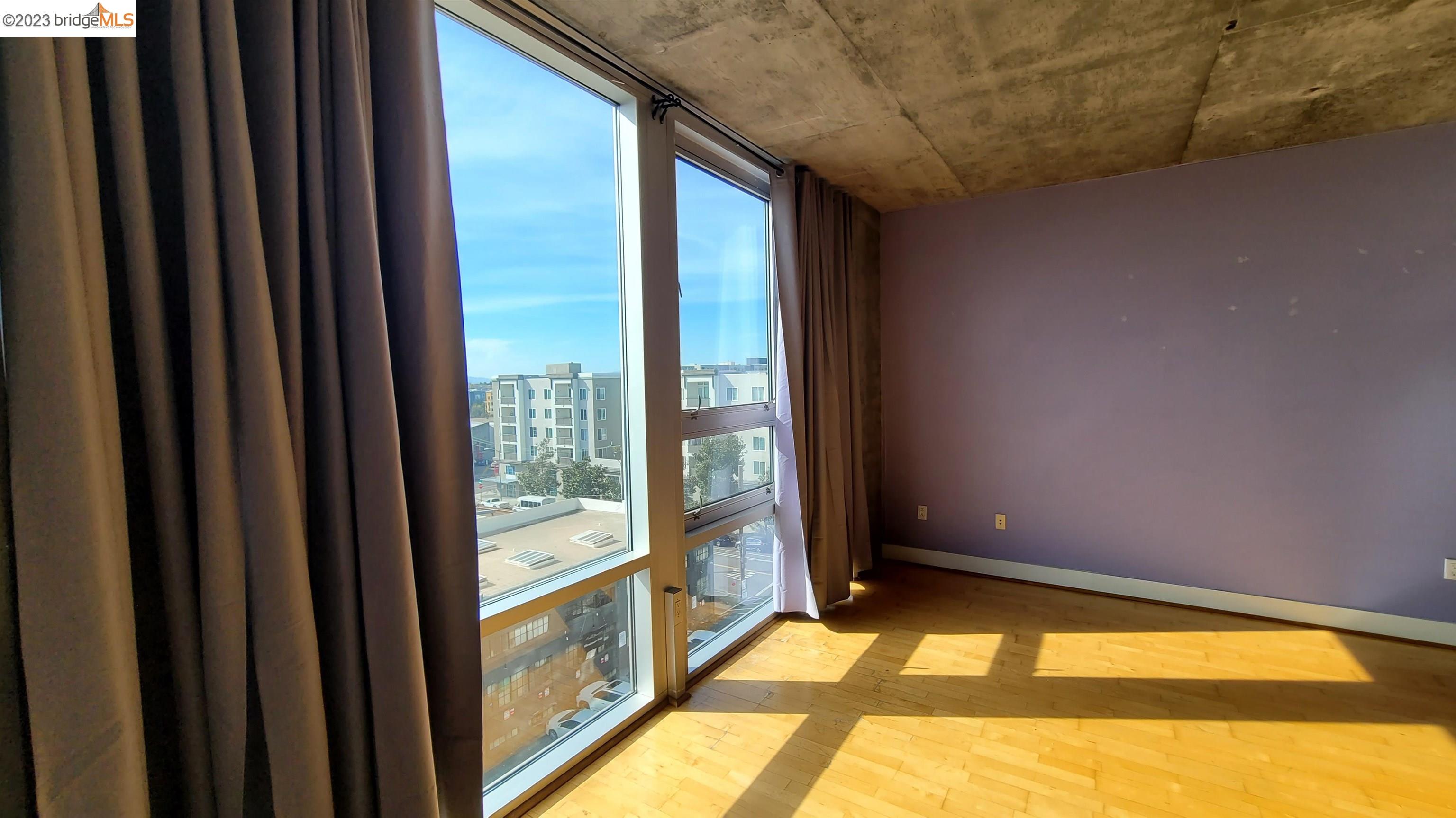 311 Oak Street, Unit 730 Oakland, CA 94607 - Photo 4 of 21 a view of an empty room and window