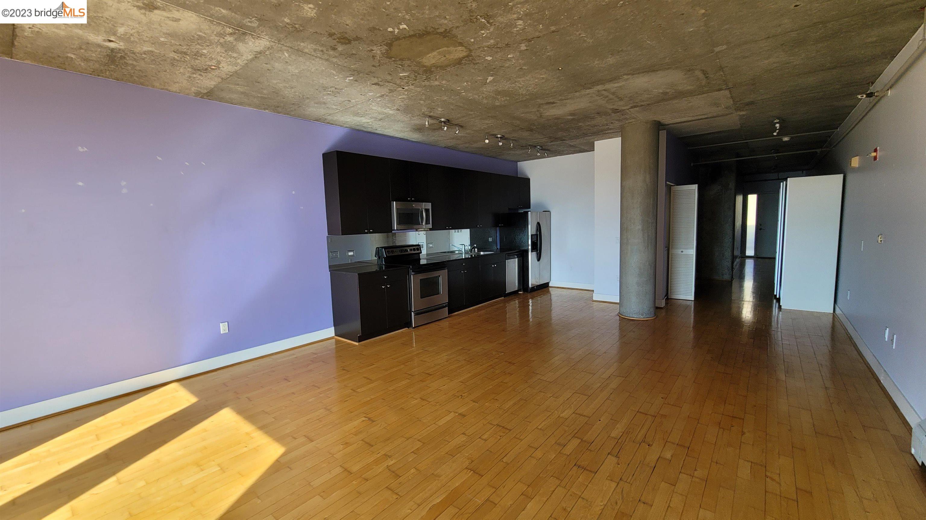 311 Oak Street, Unit 730 Oakland, CA 94607 - Photo 6 of 21 a view of kitchen and kitchen with microwave