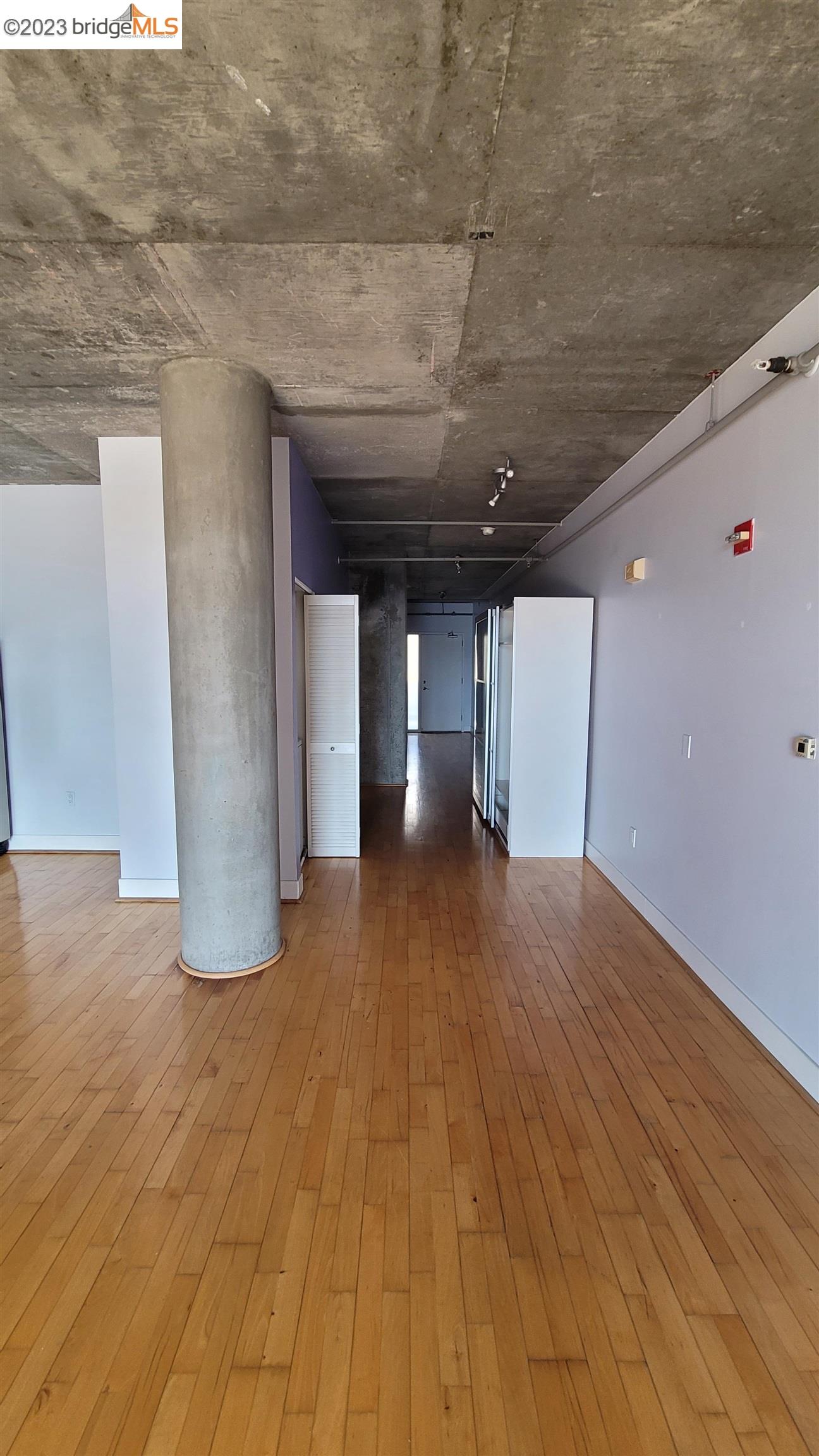 311 Oak Street, Unit 730 Oakland, CA 94607 - Photo 7 of 21 a view of empty room with wooden floor