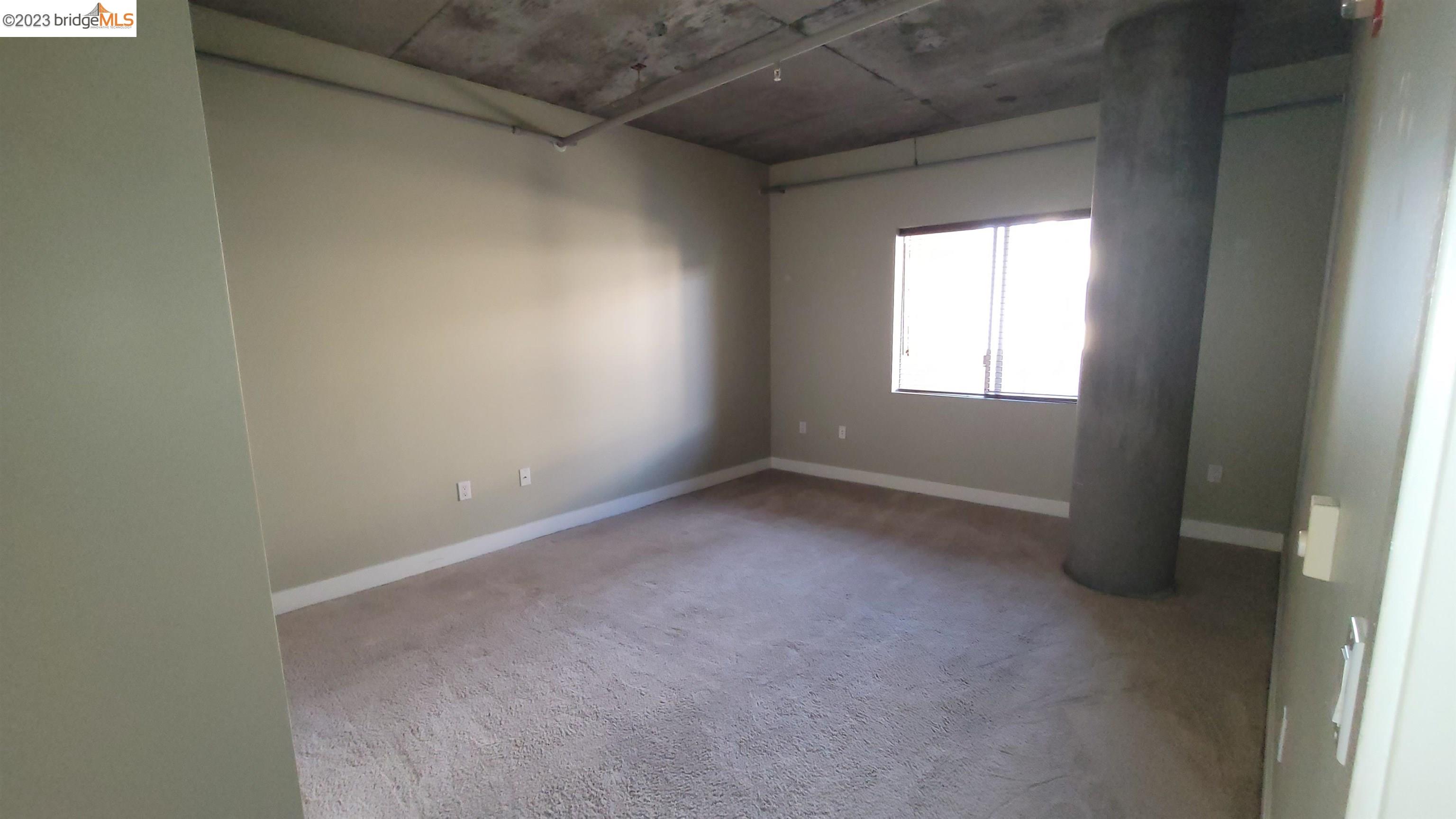 311 Oak Street, Unit 730 Oakland, CA 94607 - Photo 10 of 21 an empty room with a window