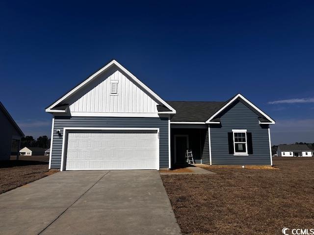 665 Castillo Drive Loris, SC 29569 - Photo 1 of 15 View of front of property featuring board and batt