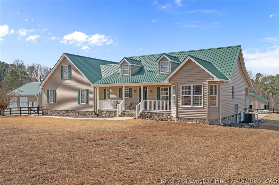 4240 Nicholson Road Cameron, NC 28326 - Photo 4 of 49 a front view of a house with a yard