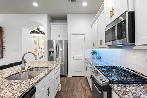 a spacious bathroom with a bathtub and a shower