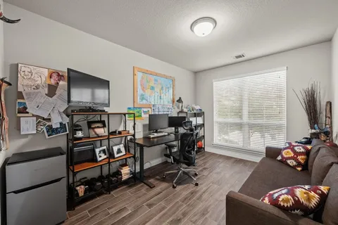 a outdoor living space with furniture and wooden floor