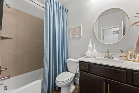 a view of a patio with a table and chairs under a umbrella