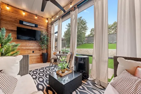 an aerial view of residential houses with outdoor space
