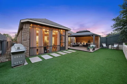 a view of a park with iron fence