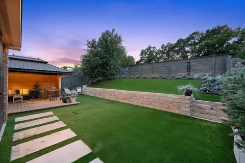 a view of a chairs and table in the patio