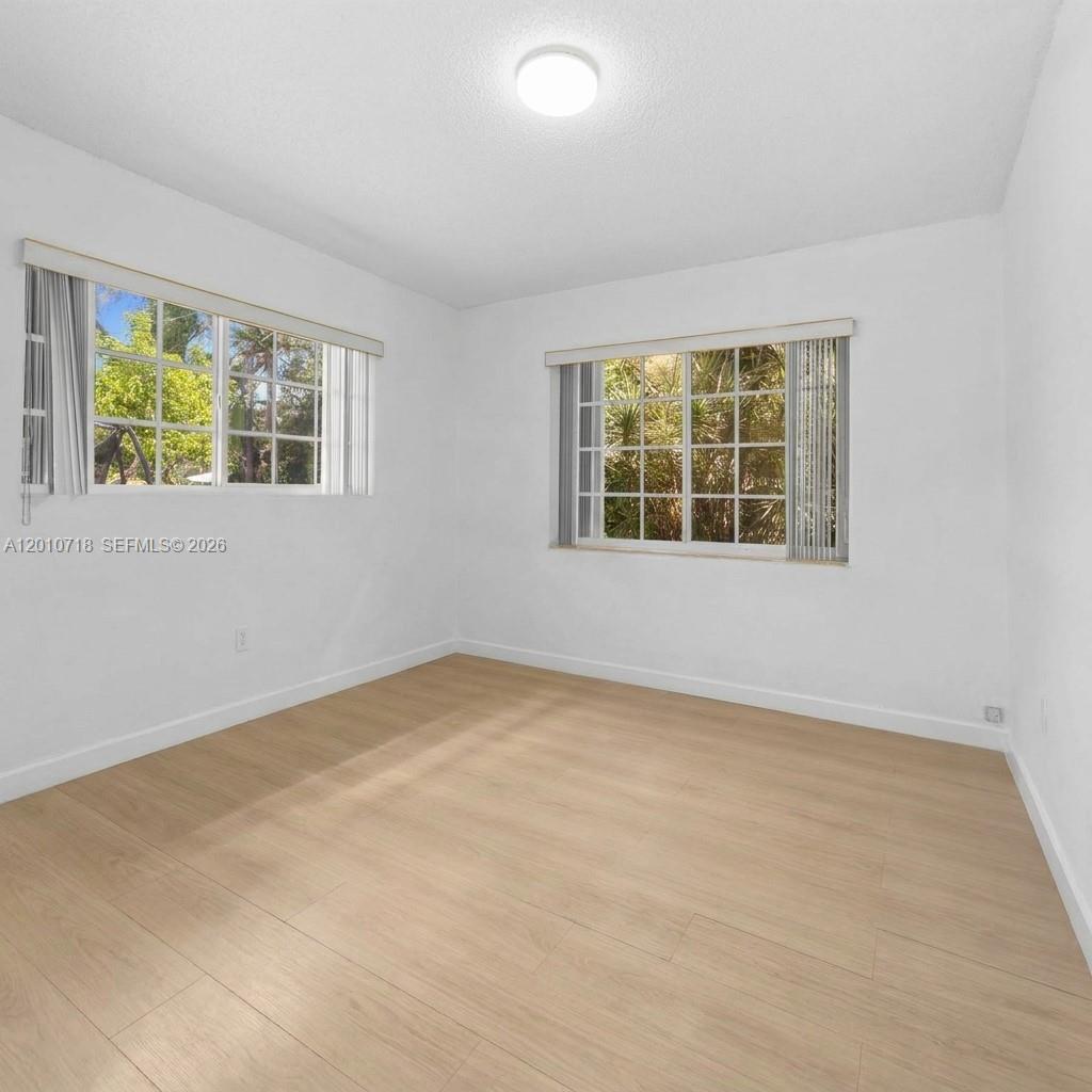 9125 Carlyle Avenue Surfside, FL 33154 - Photo 14 of 18 an empty room with a window