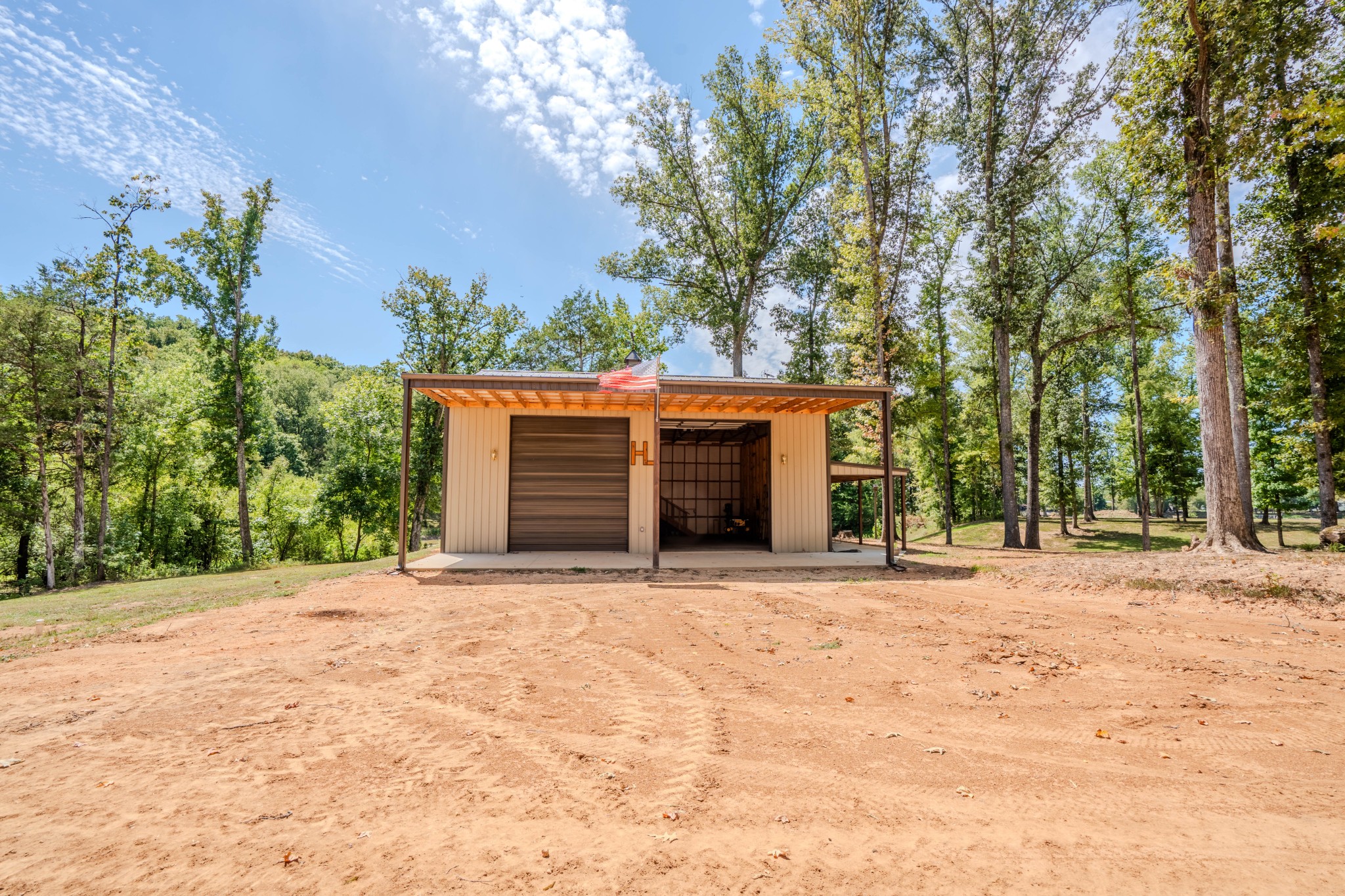1 New Era Landing Road Linden, TN 37096 - Photo 12 of 55 a front view of a house with a yard and garage