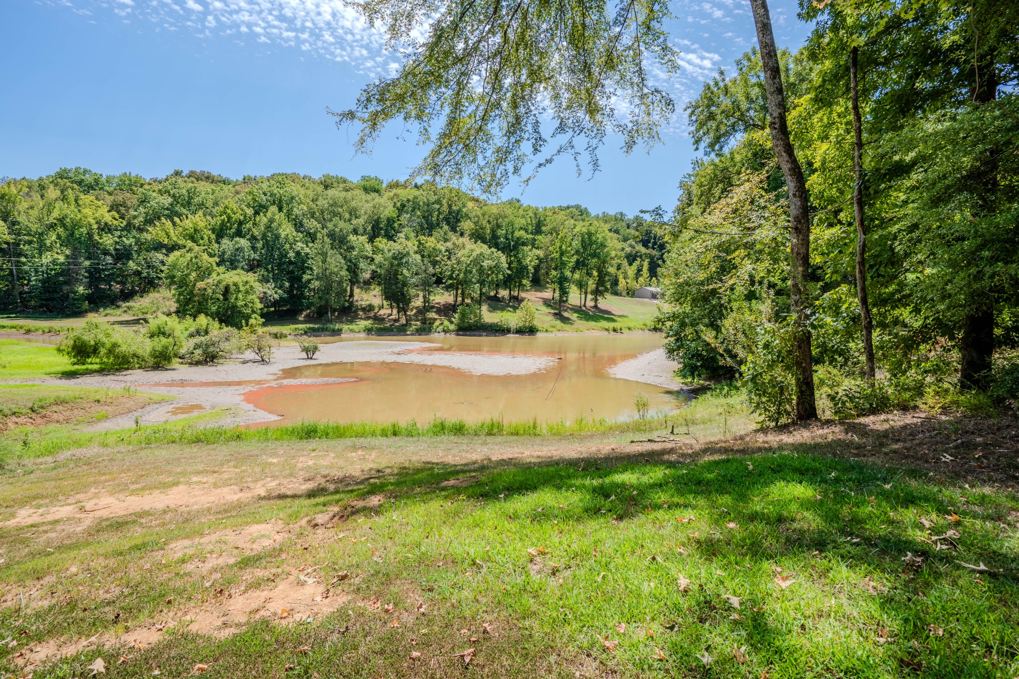 1 New Era Landing Road Linden, TN 37096 - Photo 16 of 55 a view of a lake with a yard