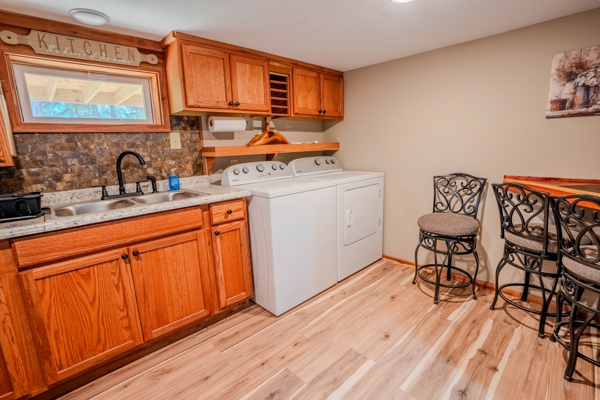 1 New Era Landing Road Linden, TN 37096 - Photo 21 of 55 a kitchen with granite countertop a sink cabinets and wooden floor