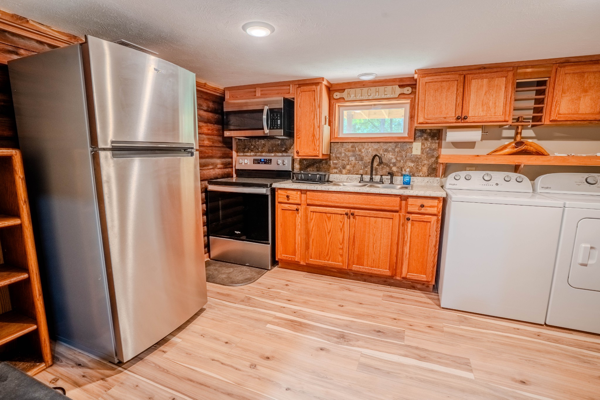 1 New Era Landing Road Linden, TN 37096 - Photo 23 of 55 a kitchen with stainless steel appliances granite countertop a refrigerator sink and cabinets