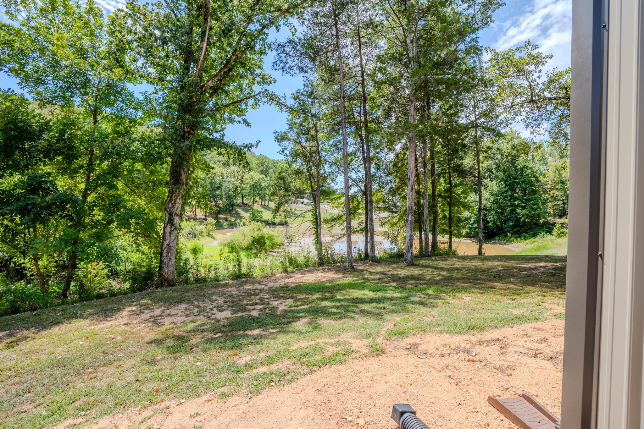1 New Era Landing Road Linden, TN 37096 - Photo 36 of 55 a view of a yard with a tree