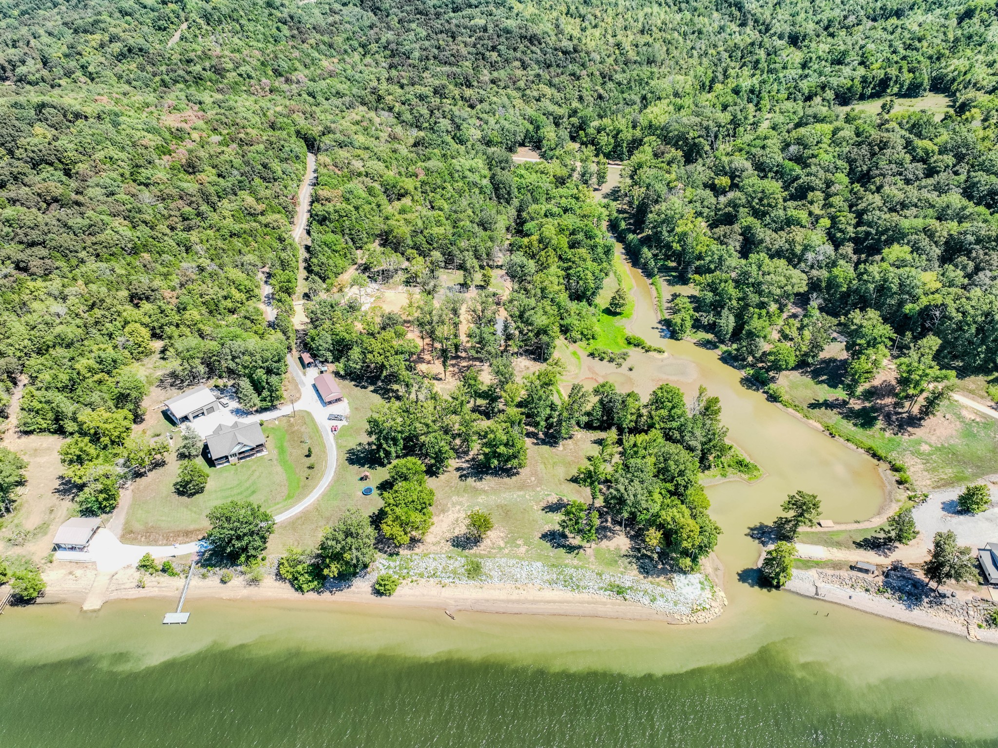 1 New Era Landing Road Linden, TN 37096 - Photo 54 of 55 a view of a garden with a tree