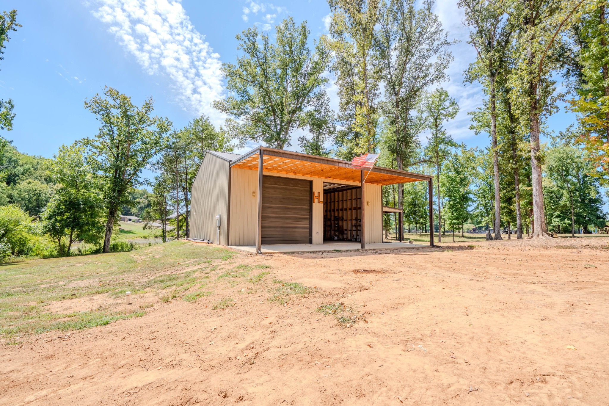 1 New Era Landing Road Linden, TN 37096 - Photo 10 of 55 a front view of a house with a yard and garage