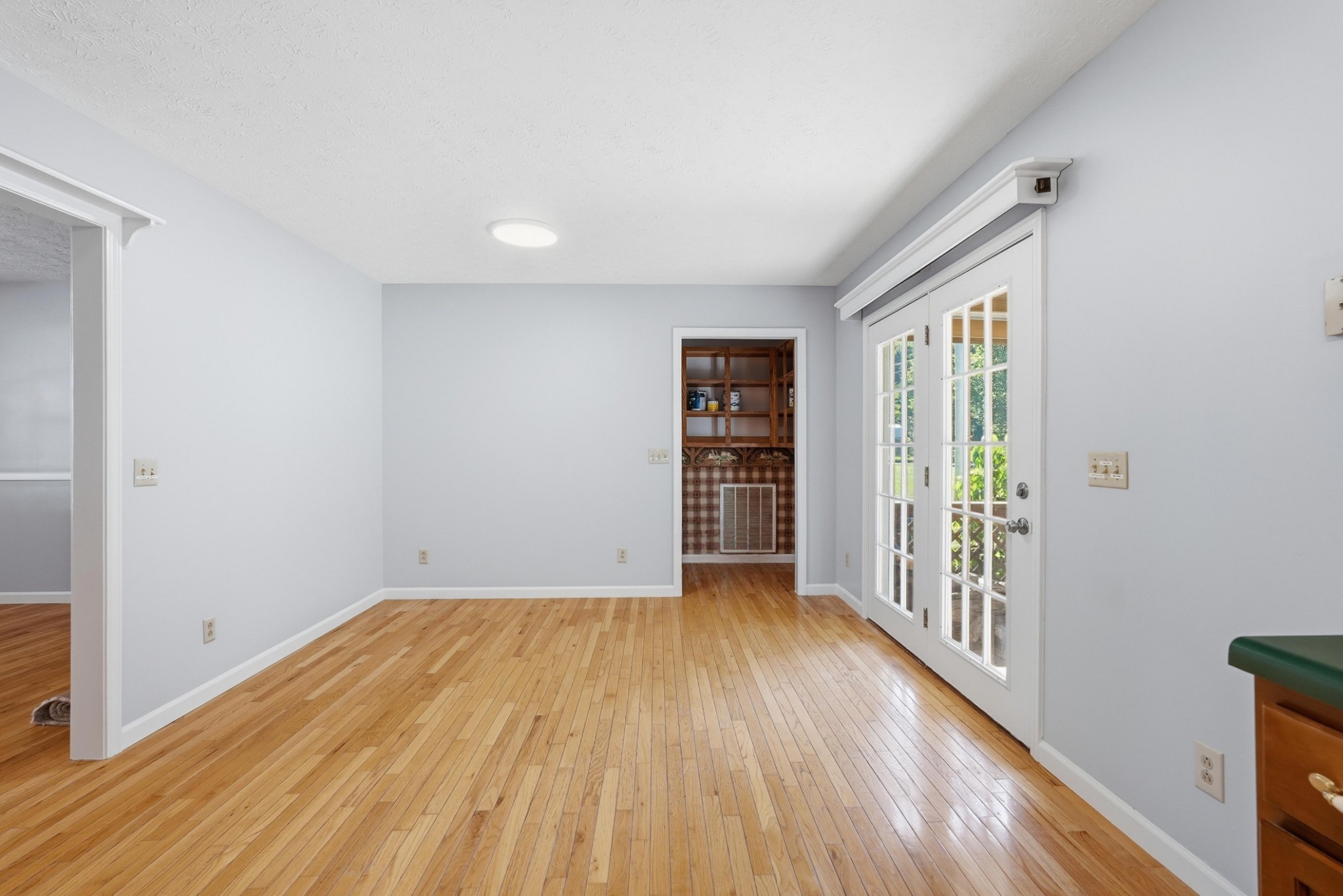 4877 Swafford Road Cookeville, TN 38501 - Photo 25 of 28 wooden floor in an empty room with a window