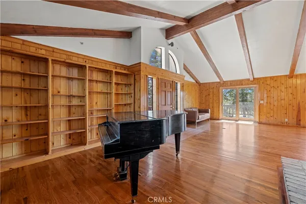 a kitchen with stainless steel appliances granite countertop a sink a stove and a wooden floors