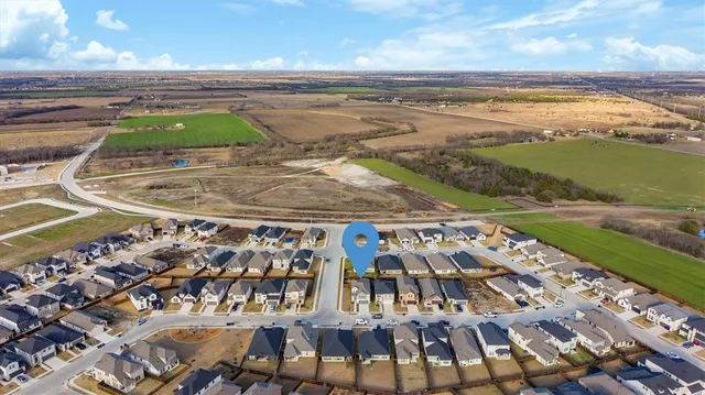 an aerial view of a swimming pool and outdoor space