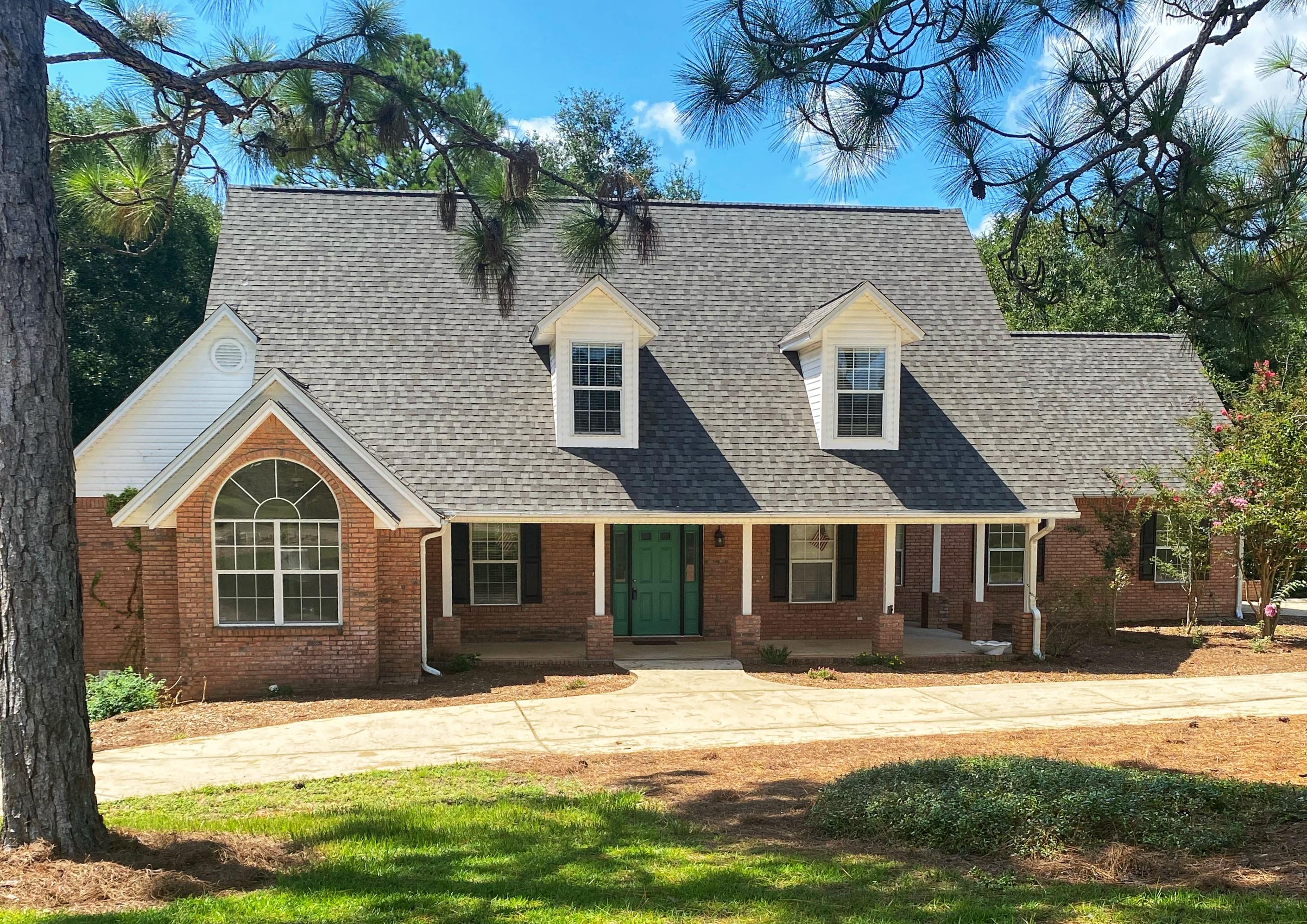 a front view of a house with a yard
