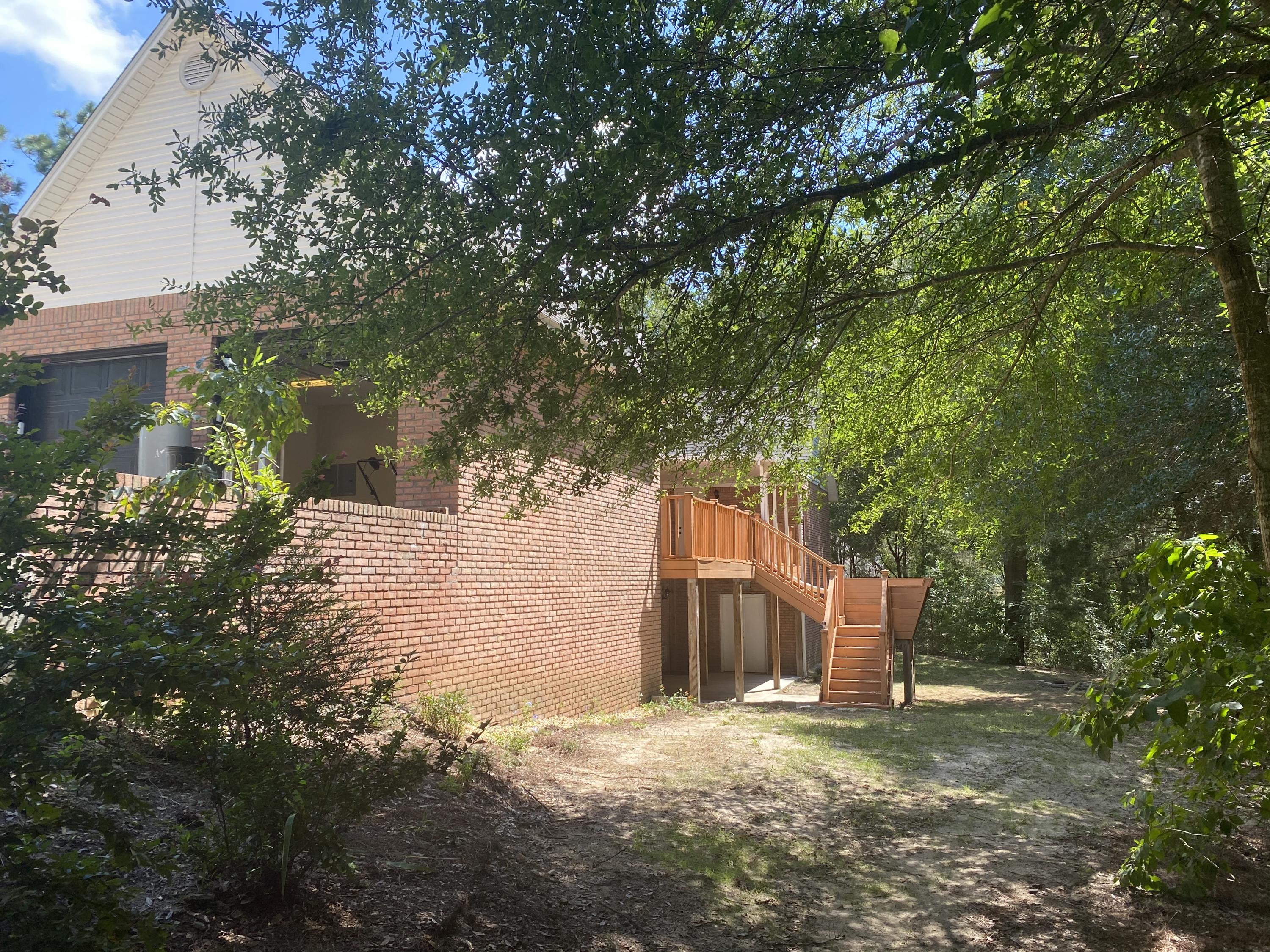 107 Blue Gill Way Crestview, FL 32539 - Photo 14 of 73 a backyard of a house with lots of green space