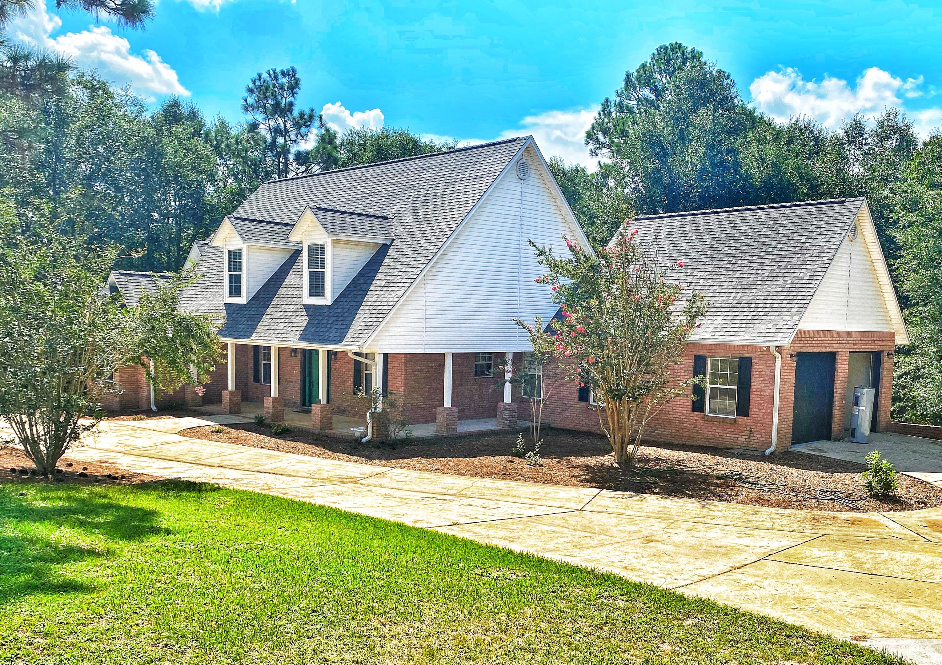 107 Blue Gill Way Crestview, FL 32539 - Photo 3 of 73 front view of a house with a yard