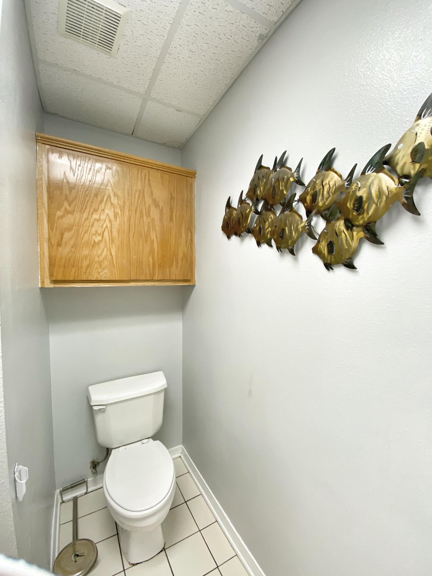 107 Blue Gill Way Crestview, FL 32539 - Photo 73 of 73 a bathroom with a toilet sink and mirror