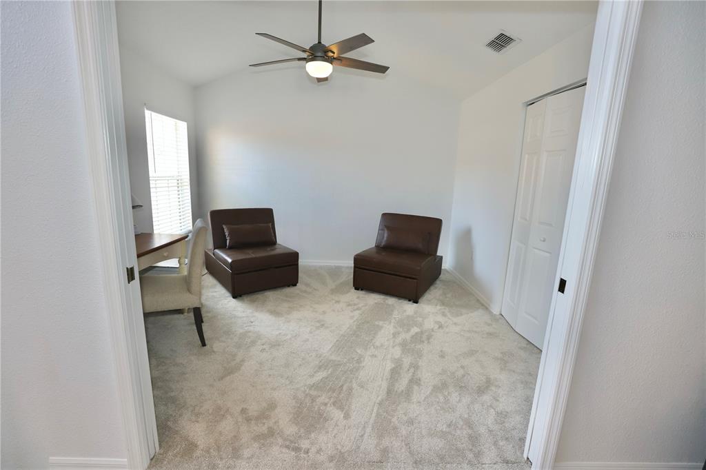 Undisclosed Address Sarasota, FL 34238 - Photo 11 of 56 a living room with furniture and a flat screen tv